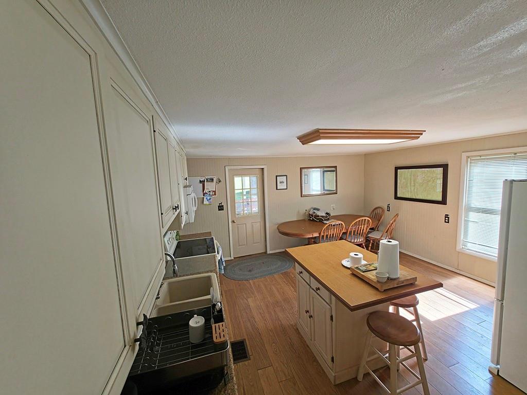3188 Winslow Hill Road Benezett, PA 15821 - Photo 7 of 27 a view of a workspace with furniture and wooden floor