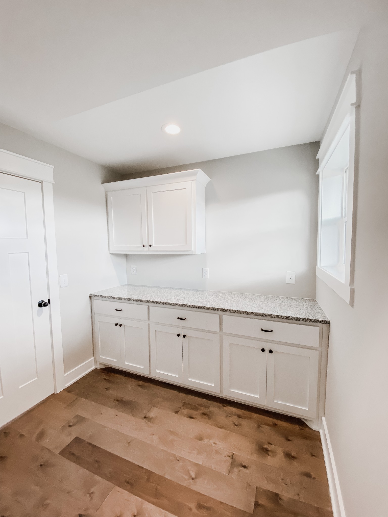4184 Oregon Road Springfield, TN 37172 - Photo 33 of 33 a room with white cabinets and wooden floor