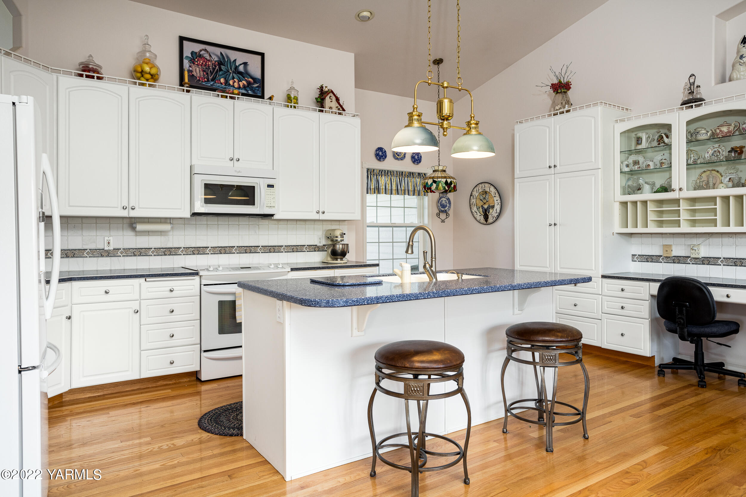200 Nash Road Tieton, WA 98947 - Photo 11 of 29 a kitchen with cabinets a sink and chairs in it