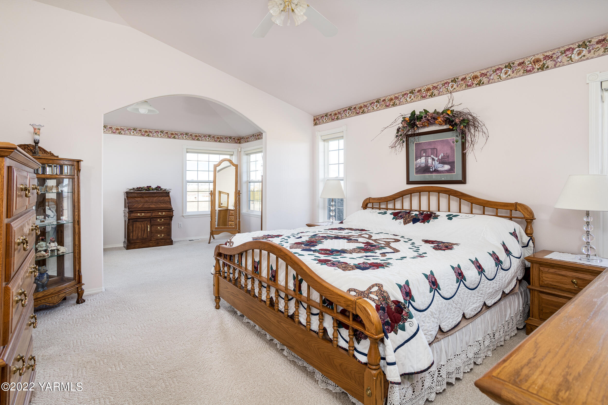 200 Nash Road Tieton, WA 98947 - Photo 16 of 29 a bedroom with a bed and a chandelier