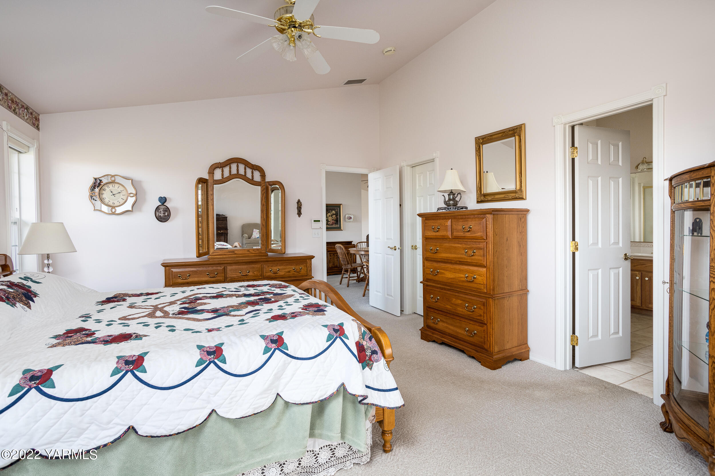 200 Nash Road Tieton, WA 98947 - Photo 18 of 29 a bedroom with a bed and dresser with mirror