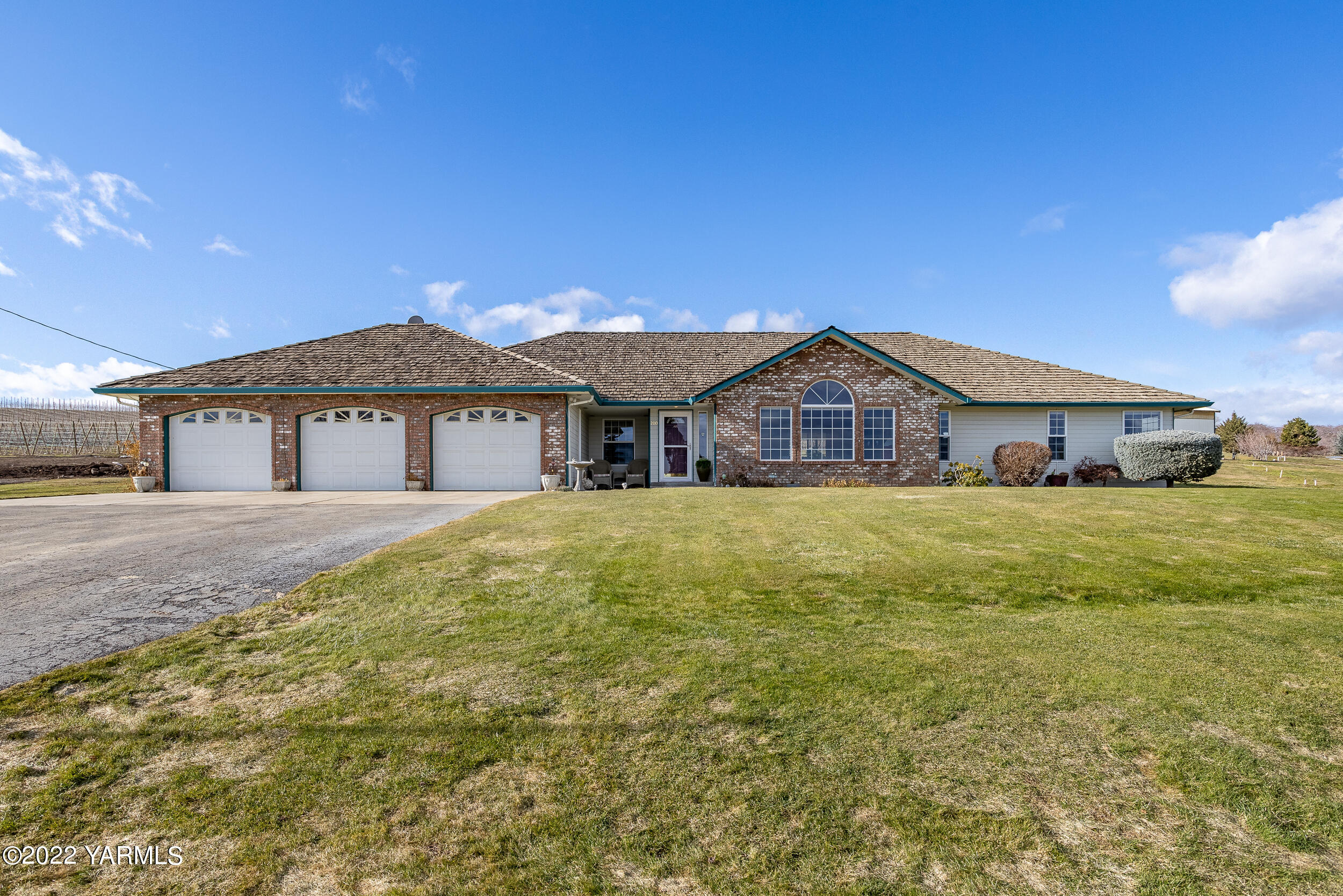 200 Nash Road Tieton, WA 98947 - Photo 2 of 29 a front view of a house with a yard