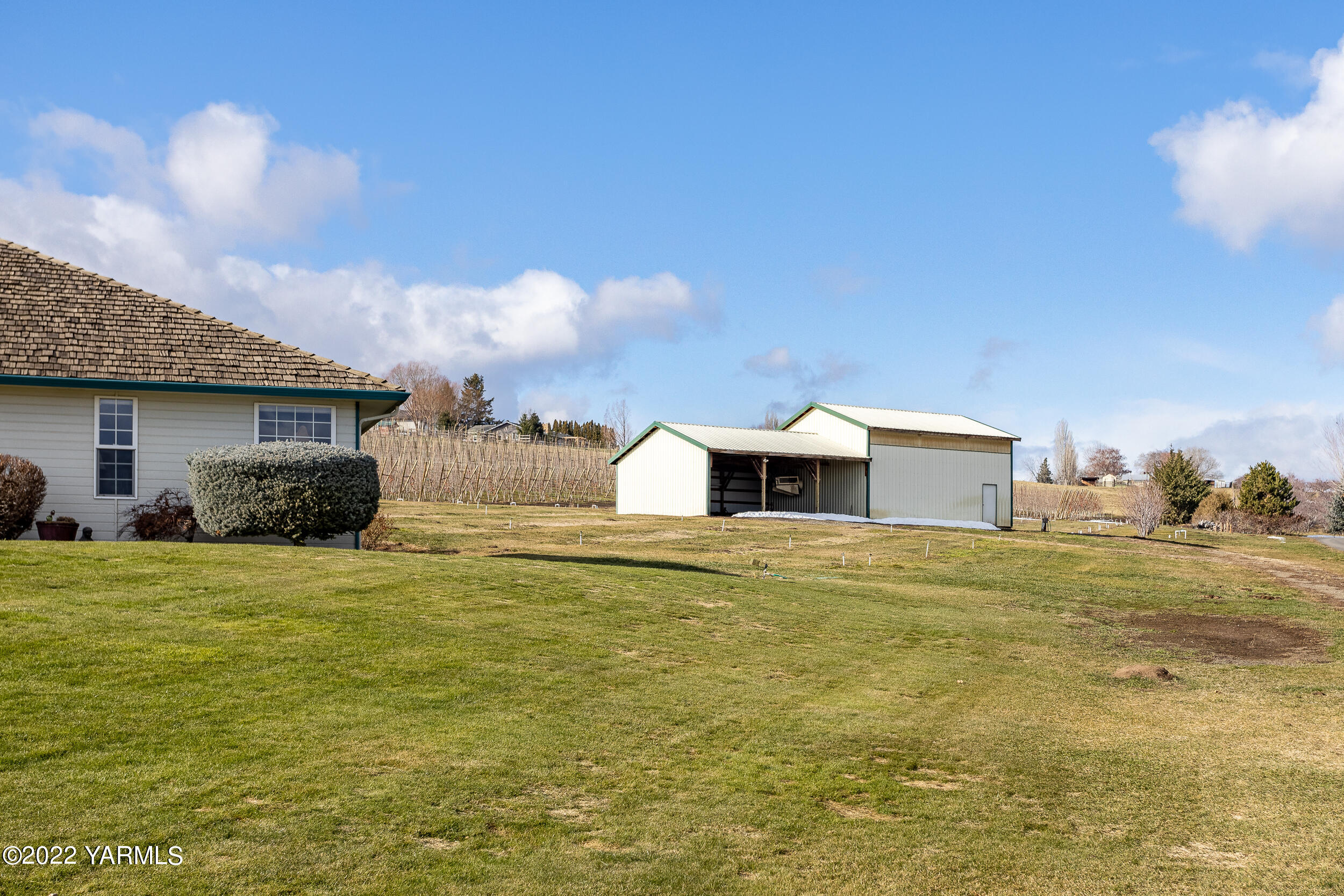 200 Nash Road Tieton, WA 98947 - Photo 25 of 29 a big house with a big yard and large trees