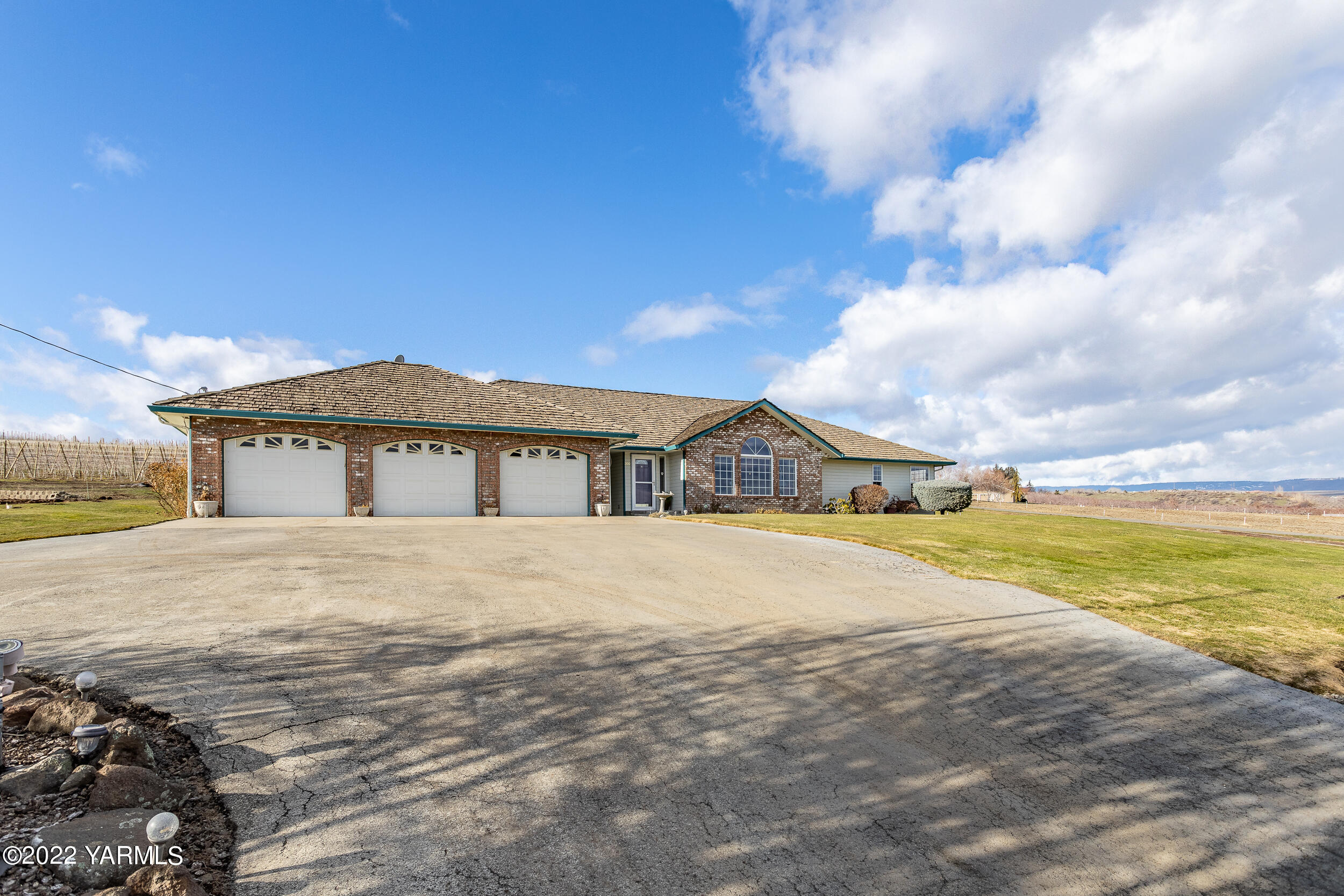 200 Nash Road Tieton, WA 98947 - Photo 3 of 29 a front view of a house with a yard
