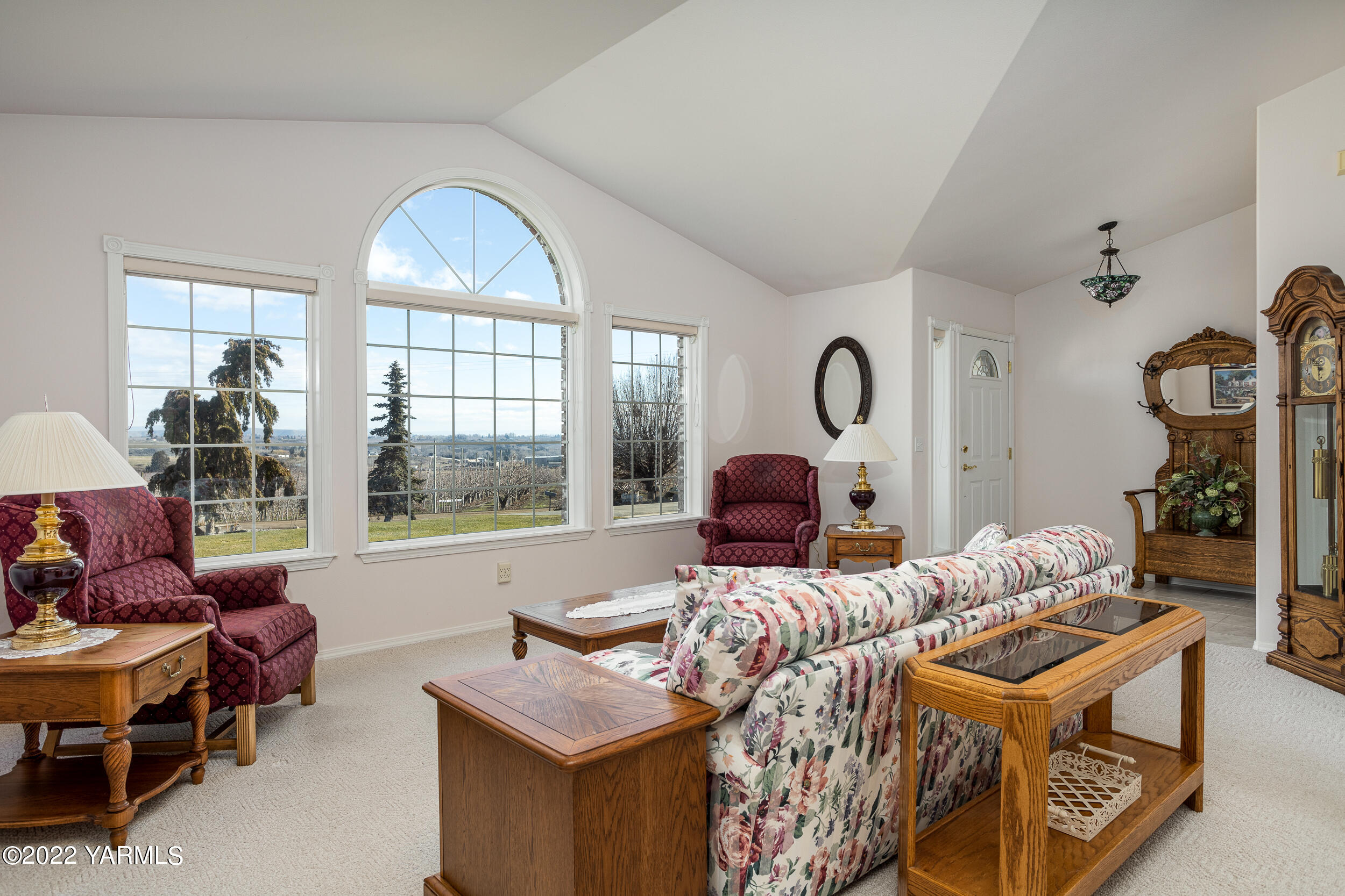 200 Nash Road Tieton, WA 98947 - Photo 8 of 29 a living room with furniture a window and a chandelier