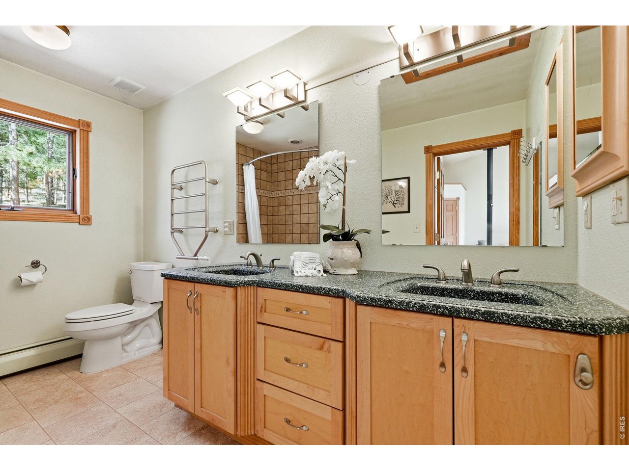 560 Quillan Gulch Road Loveland, CO 80537 - Photo 20 of 49 Attached Primary Bath with heated towel rack and dual vanities
