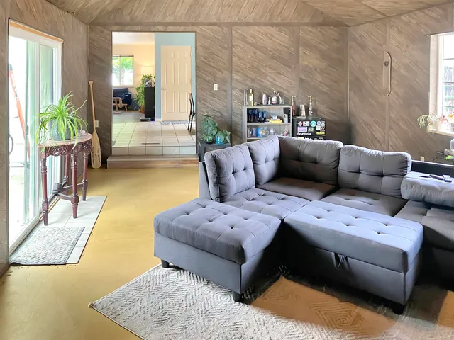 a living room with furniture and a couch