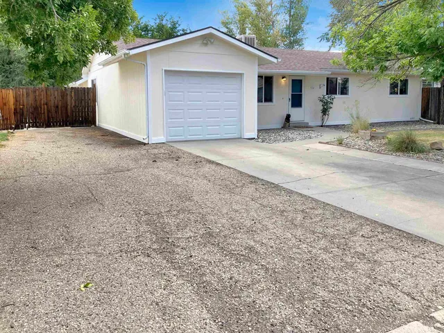a front view of a house with a outdoor space