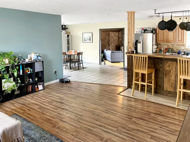 a room with furniture and wooden floor