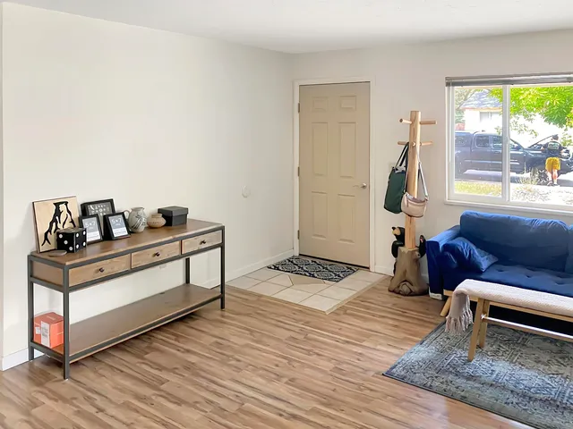 a living room with furniture and a window