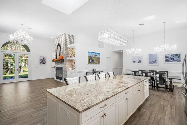 a view of a living room with furniture and a fireplace