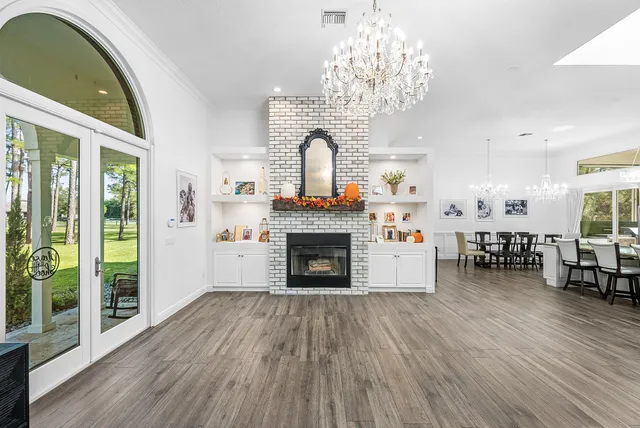a bathroom with a double vanity sink mirror and shower