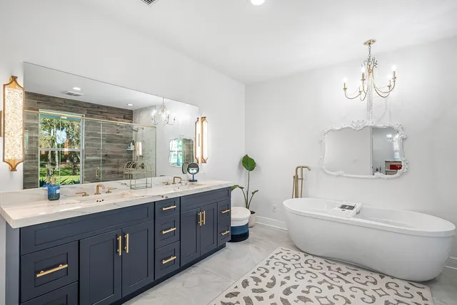 a kitchen with a refrigerator and a stove top oven