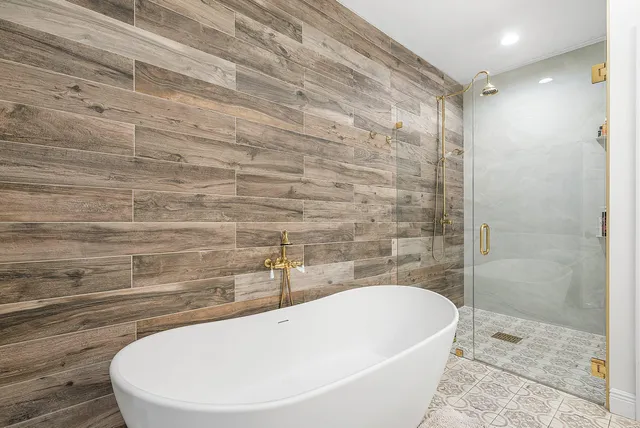 a living room with patio furniture and a wooden floor