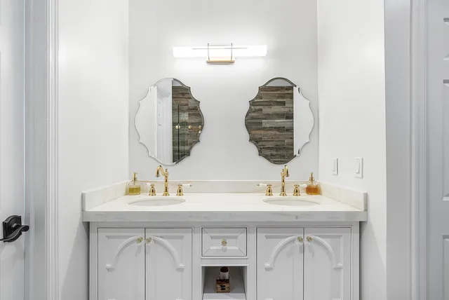 a living room with furniture a flat screen tv and a floor to ceiling window