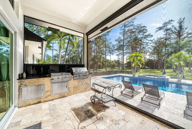 an aerial view of a house with a yard and a garden