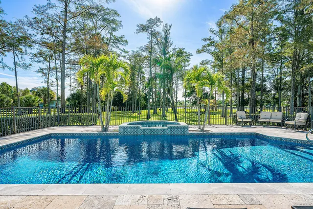 a view of a swimming pool with a lake view