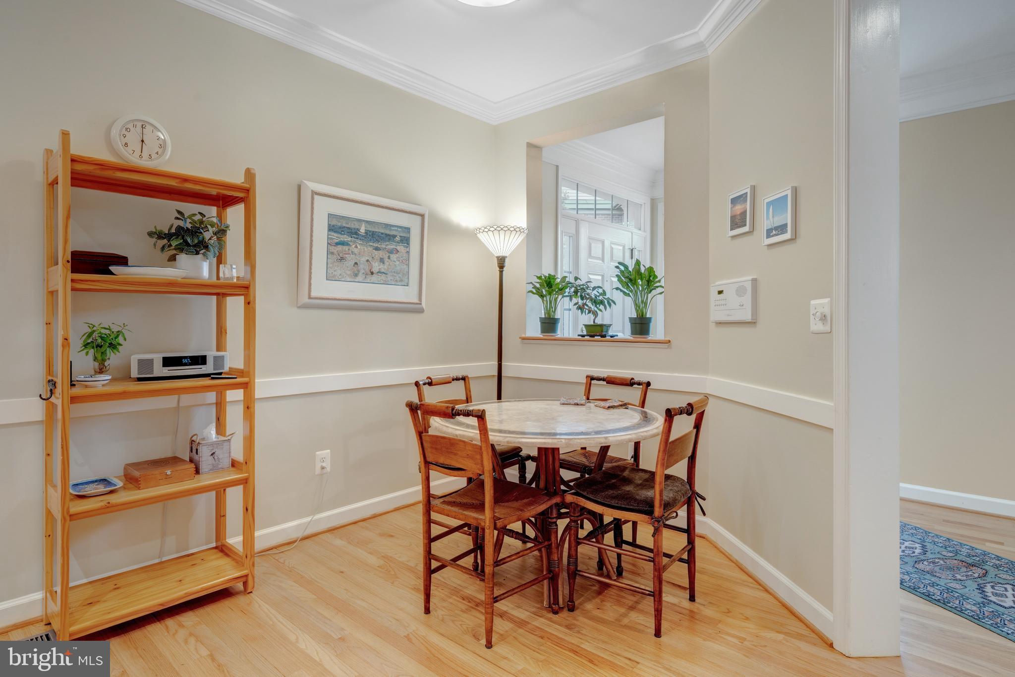 1925 Logan Manor Drive Reston, VA 20190 - Photo 18 of 61 a view of a dining room with furniture and wooden floor