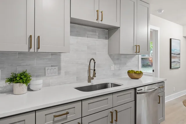 a kitchen with a sink and cabinets