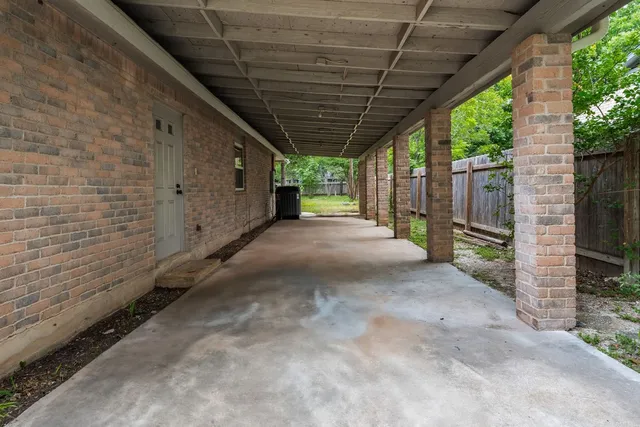 a view of a house with yard and sitting area
