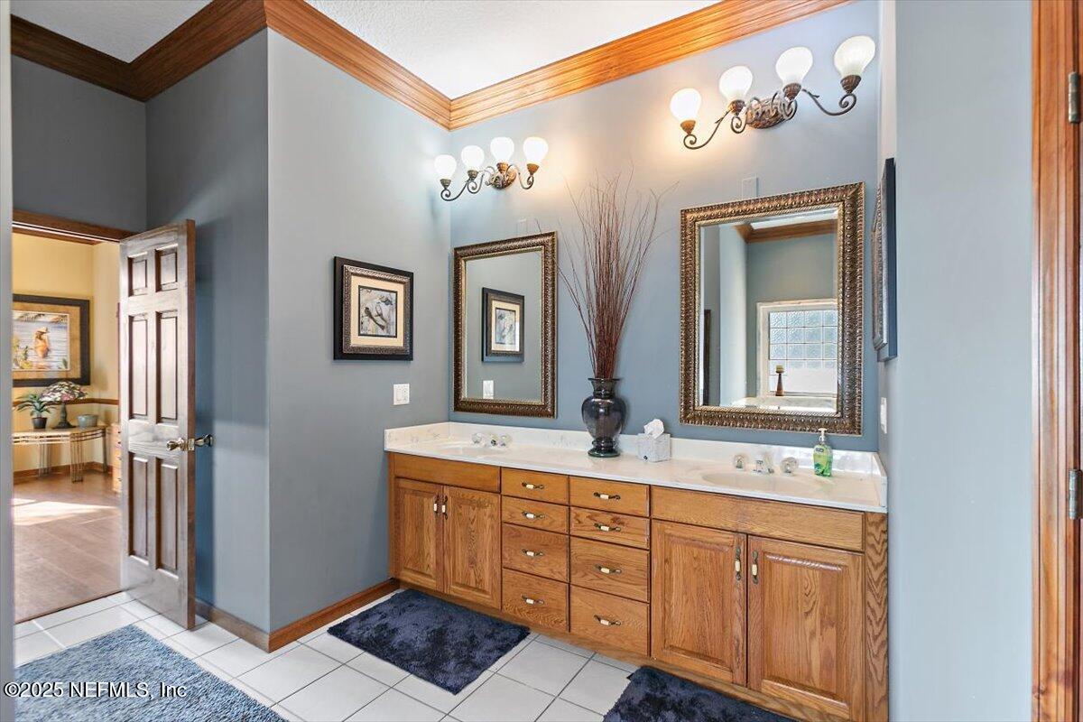 85232 Amanda Court Yulee, FL 32097 - Photo 16 of 42 a bathroom with a sink double vanity and a mirror