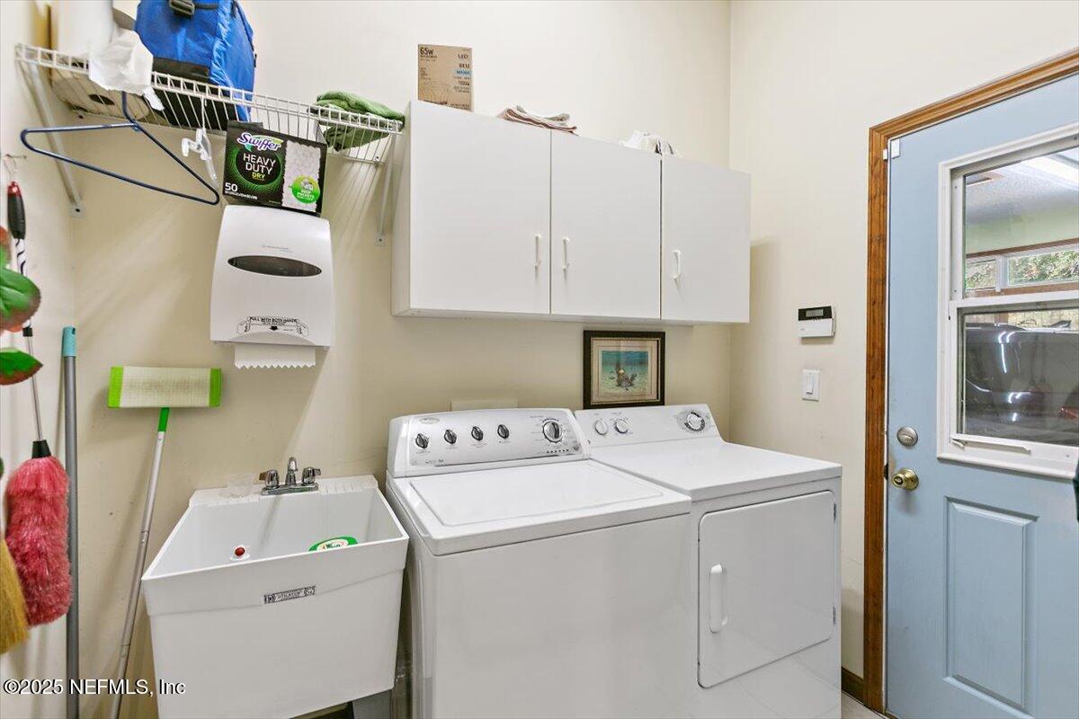 85232 Amanda Court Yulee, FL 32097 - Photo 21 of 42 a utility room with dryer and washer
