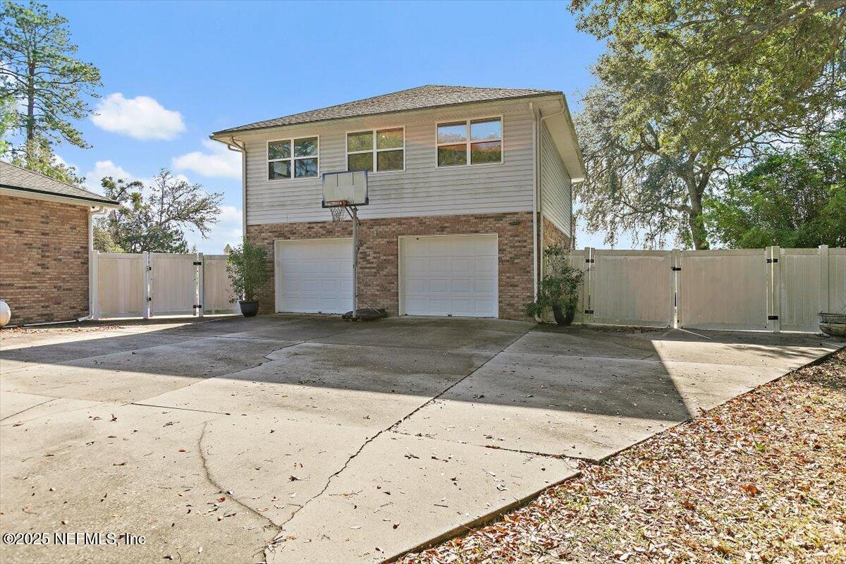 85232 Amanda Court Yulee, FL 32097 - Photo 39 of 42 a front view of a house with a yard