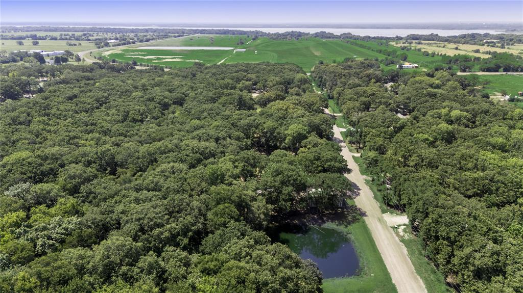 7243 County Road 3512 Quinlan, TX 75474 - Photo 13 of 14 Drone / aerial view of a large body of water and a forest