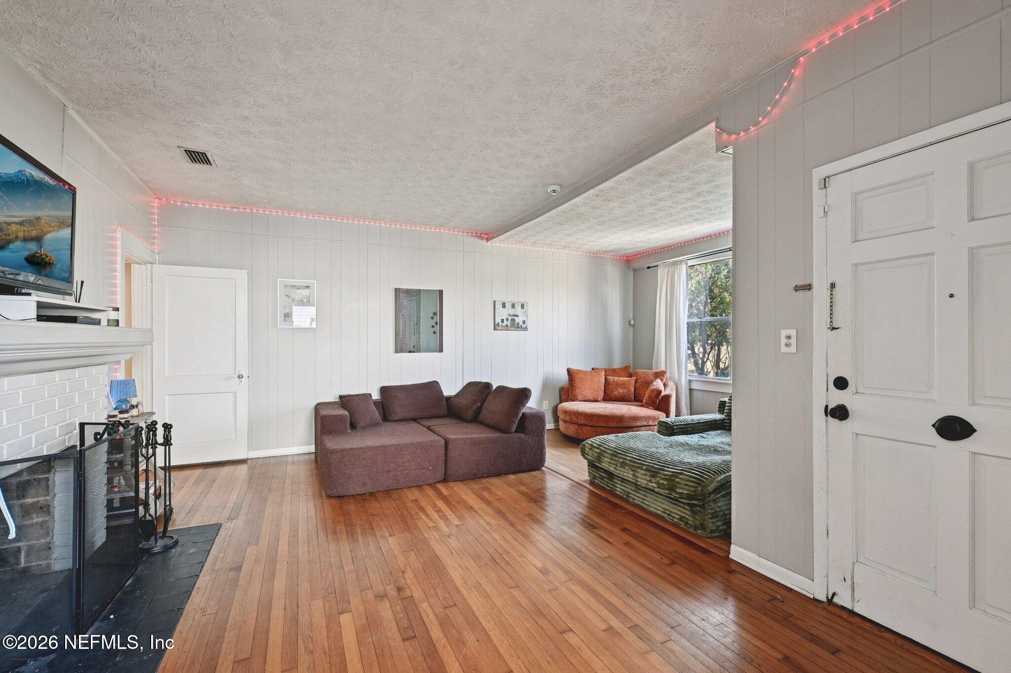 1021 Old Hickory Road Jacksonville, FL 32207 - Photo 12 of 42 a living room with furniture and a wooden floor