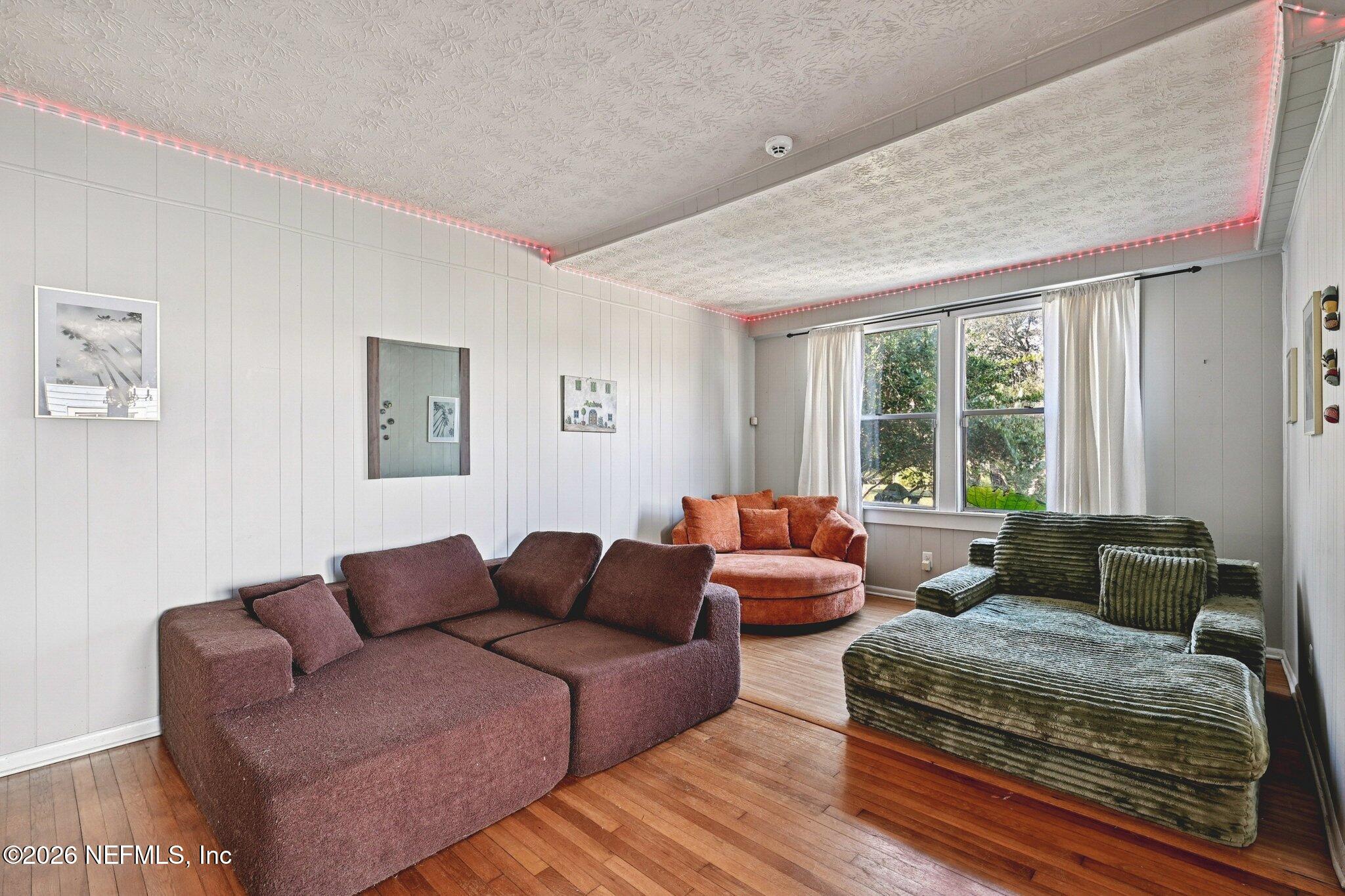 1021 Old Hickory Road Jacksonville, FL 32207 - Photo 13 of 42 a living room with furniture and a large window