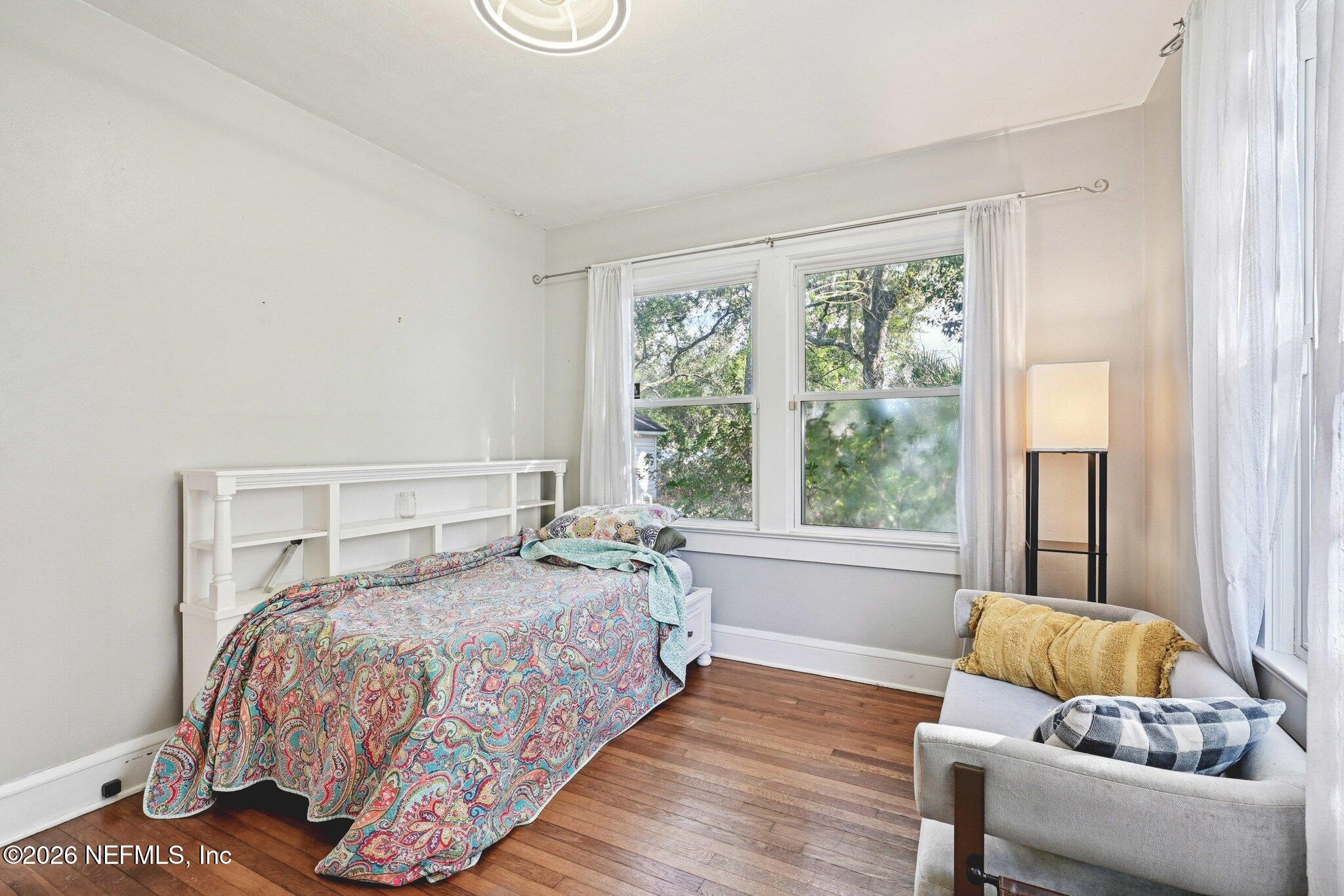 1021 Old Hickory Road Jacksonville, FL 32207 - Photo 23 of 42 a bedroom with a bed and glass window