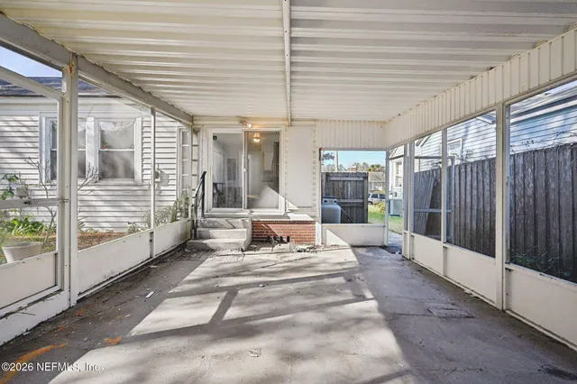 a view of a balcony with furniture