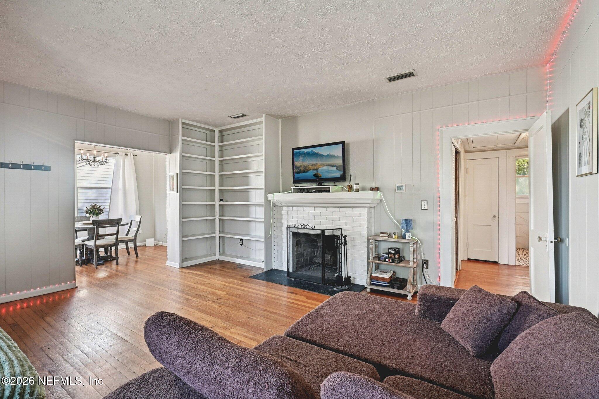1021 Old Hickory Road Jacksonville, FL 32207 - Photo 3 of 42 a living room with furniture and a fireplace