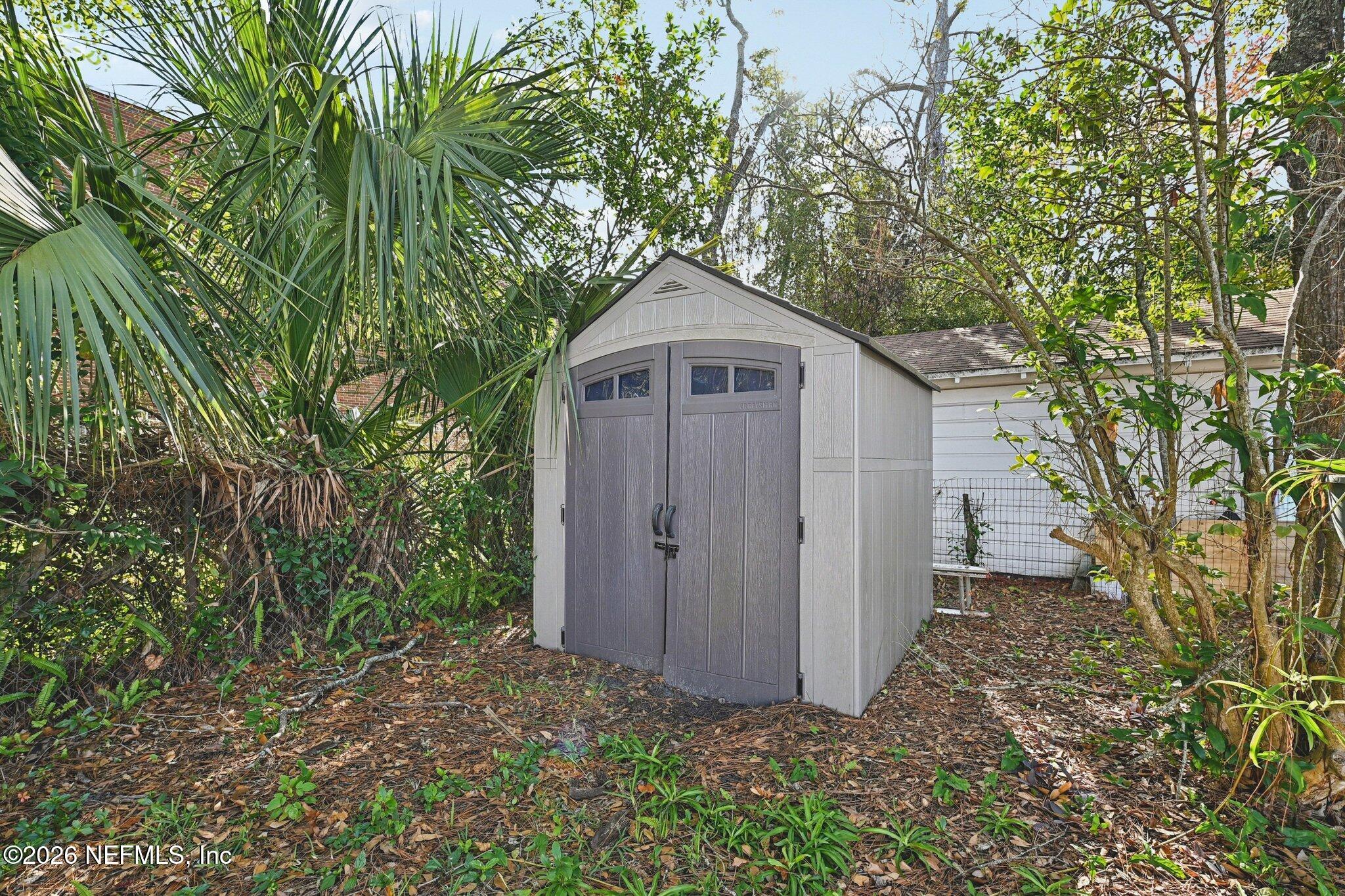 1021 Old Hickory Road Jacksonville, FL 32207 - Photo 38 of 42 a front view of a house with a yard and large trees
