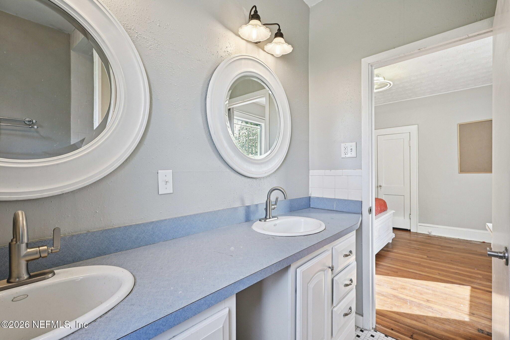 1021 Old Hickory Road Jacksonville, FL 32207 - Photo 7 of 42 a bathroom with a sink and a mirror