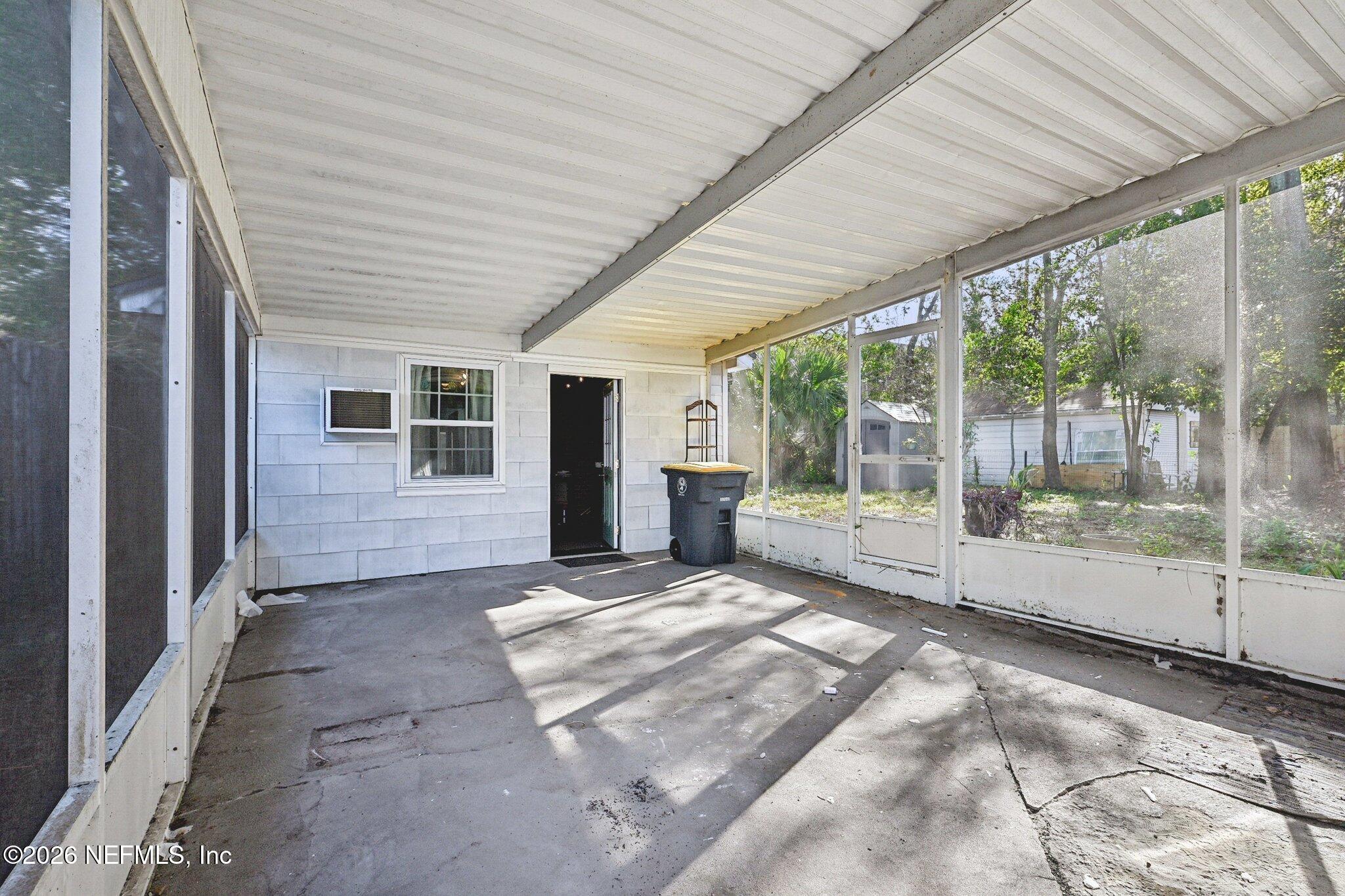 1021 Old Hickory Road Jacksonville, FL 32207 - Photo 8 of 42 a view of backyard with a large window and swimming pool