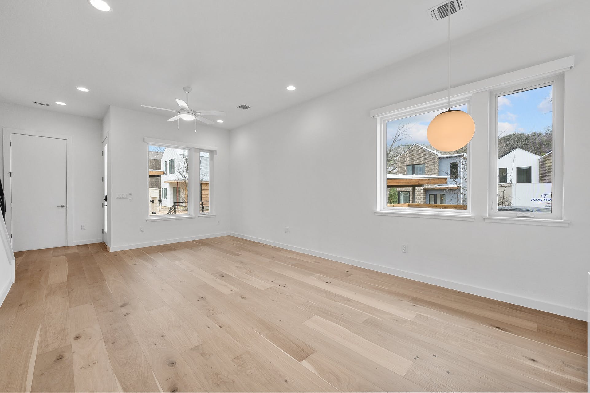 900 South 2nd Street, Unit 15 Austin, TX 78704 - Photo 11 of 31 a view of an empty room with a window and wooden floor