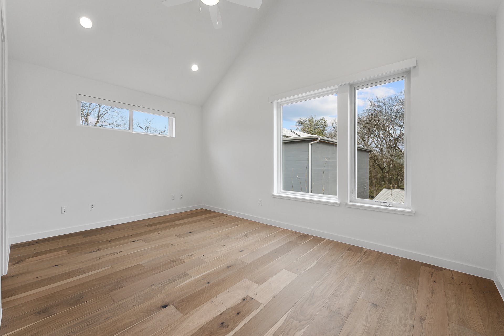 900 South 2nd Street, Unit 15 Austin, TX 78704 - Photo 15 of 31 a view of an empty room with wooden floor and a window