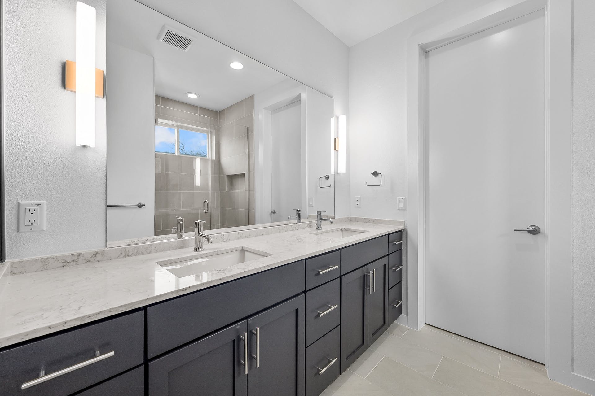 900 South 2nd Street, Unit 15 Austin, TX 78704 - Photo 17 of 31 a bathroom with a double vanity sink and a mirror