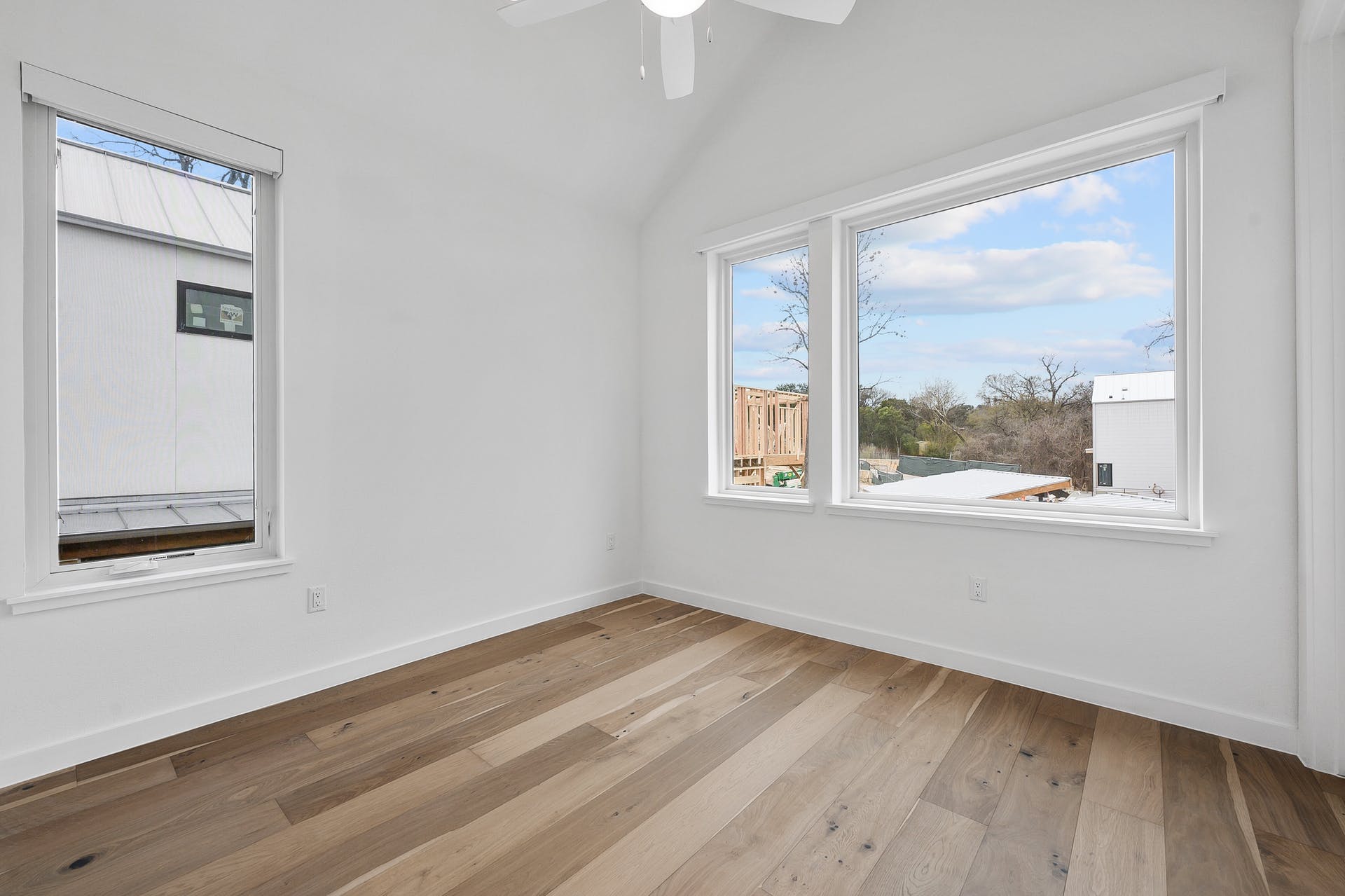 900 South 2nd Street, Unit 15 Austin, TX 78704 - Photo 19 of 31 a view of an empty room with wooden floor and a window