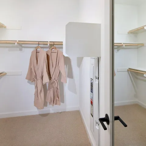 a view of a closet with storage