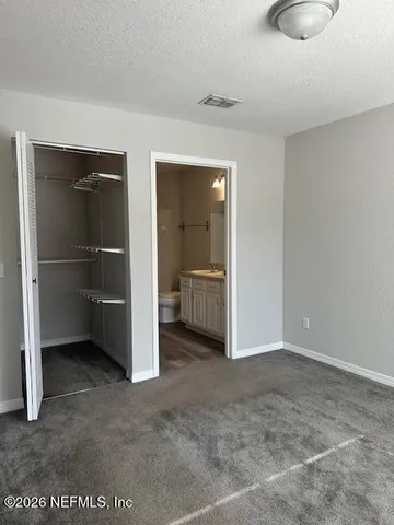 a balcony with furniture and a potted plant