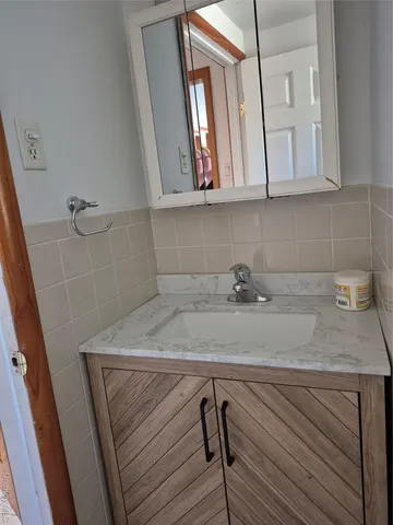 a view of a sink and cabinets
