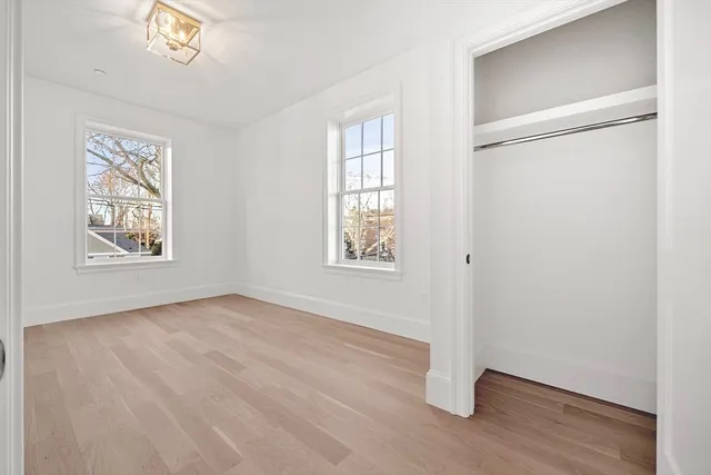 a bathroom with a double vanity sink mirror and shower