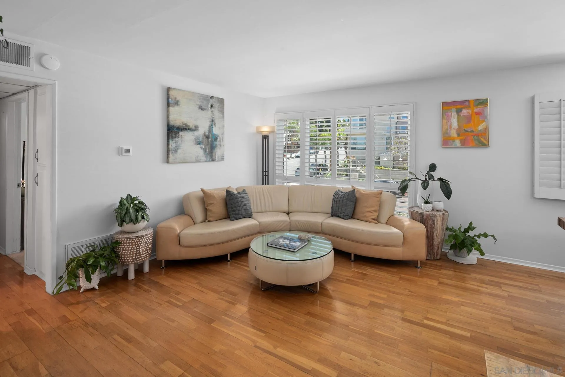 3266 1st Avenue, Unit 20 San Diego, CA 92103 - Photo 12 of 37 a living room with furniture and a wooden floor