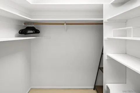 a view of an empty walk in closet