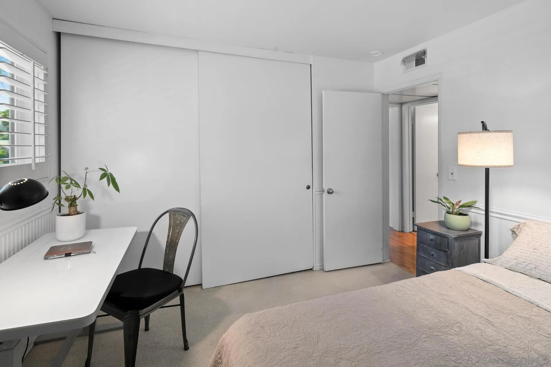 3266 1st Avenue, Unit 20 San Diego, CA 92103 - Photo 19 of 37 a bedroom with a bed and a chair