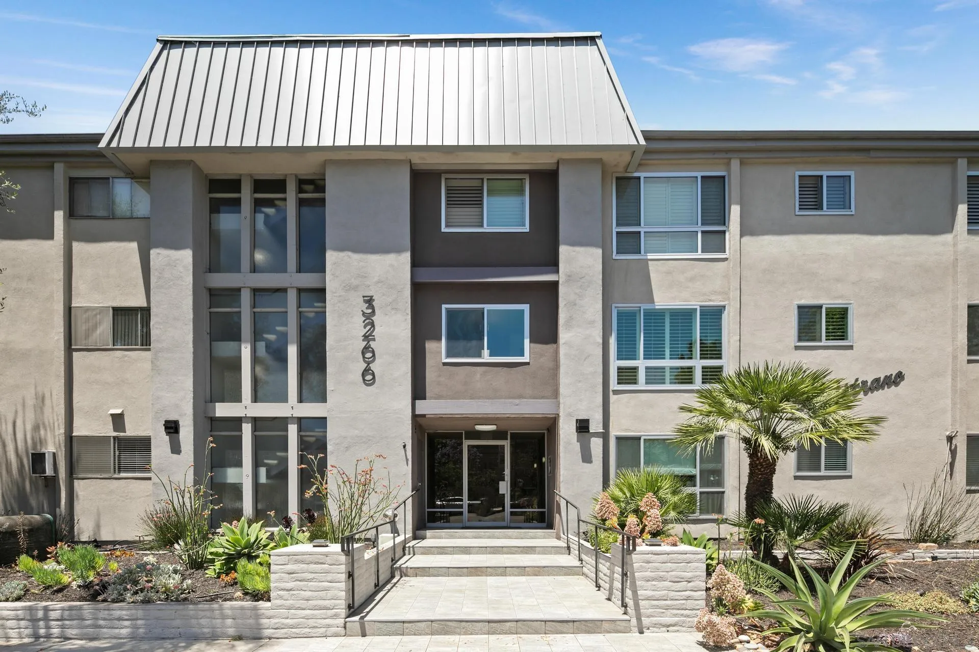 3266 1st Avenue, Unit 20 San Diego, CA 92103 - Photo 21 of 37 a front view of a house with a garden
