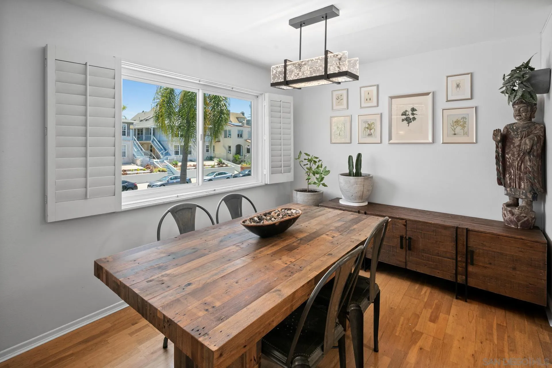 3266 1st Avenue, Unit 20 San Diego, CA 92103 - Photo 3 of 37 a kitchen with a table chairs and wooden floor