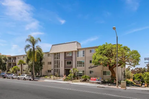 a view of a street with a building in the background